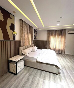 Deluxe Apartment, Balcony, City View | In-room safe, desk, laptop workspace, blackout curtains - Palms Regalia Luxury Apartment (Port Harcourt)