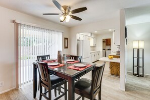 A modern kitchen with white cabinets, a built-in oven, and a central island. - Close to Golf! 55-plus Snowbird Escape in Mesa (Mesa)