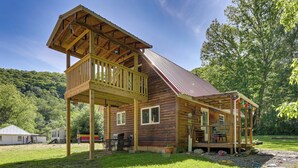 A wooden cabin with a balcony, a covered porch, and a metal roof. - Family Cabin! Close to Greenbrier River & Snowshoe (Cass)