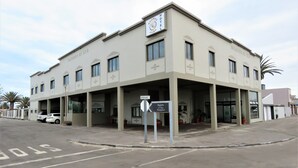 A hotel with a sign indicating a reception area.