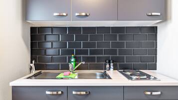 Fridge, stovetop, coffee/tea maker, cookware/dishes/utensils