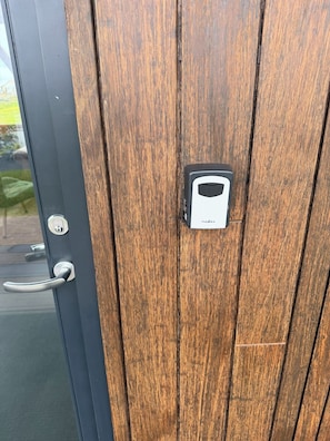 A wooden door with a keyhole and a lock. - Valey Countryside Escape (Hvammstangi)