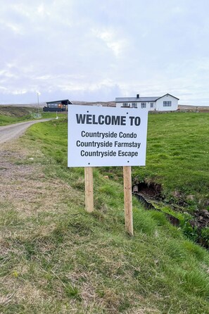 A welcome sign for Countryside Escape, a farmstay and condo. - Valey Countryside Escape (Hvammstangi)