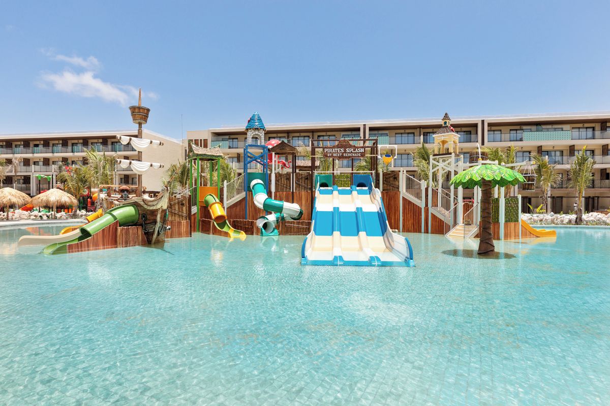 A water park area with slides and a pool.