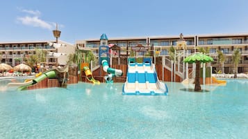 A water park area with slides and a pool.