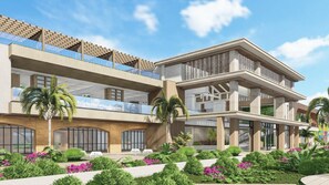 A multi-story hotel with balconies, large windows, and a landscaped garden. - Serenade Caribe Club Family Beach Resort (Punta Cana)