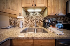 Fridge, microwave, oven, stovetop - This condo located in Winter Park Colorado with distinct lodge feel (Winter Park)