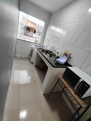 Private kitchen - One-bedroom apartment with sofa bed. (Rio das Ostras)