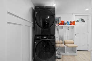 stacking washer dryer in laundry room