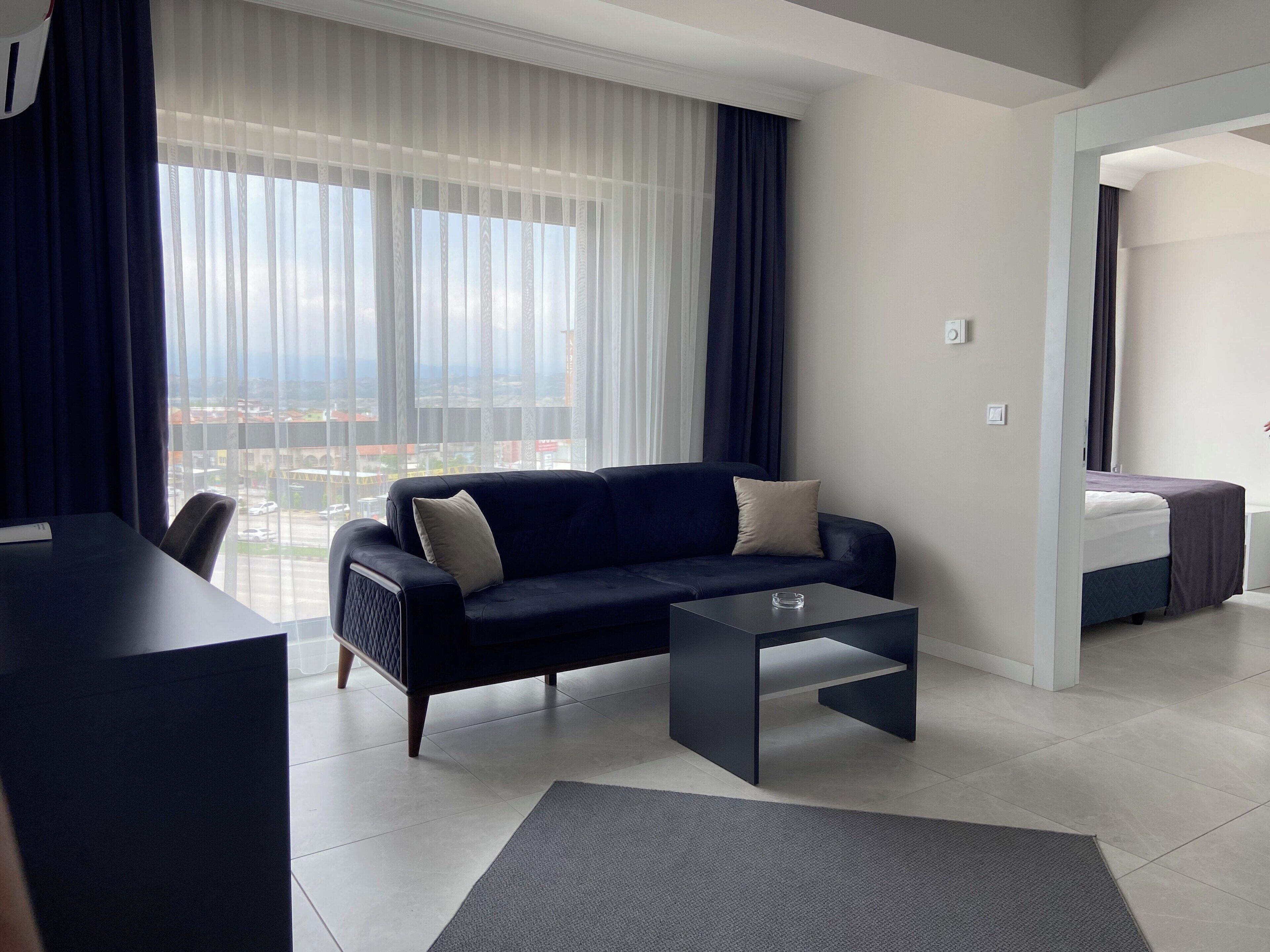 Chambre Simple Deluxe, vue ville | Coin séjour