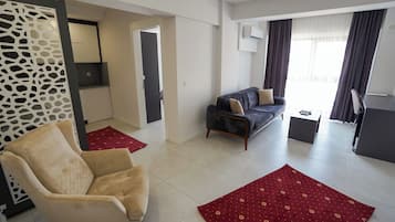 Comfort Suite, Multiple Beds | Desk, laptop workspace, blackout drapes, iron/ironing board