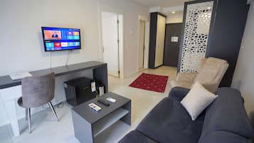 Family Suite, Multiple Beds | Desk, laptop workspace, blackout drapes, iron/ironing board