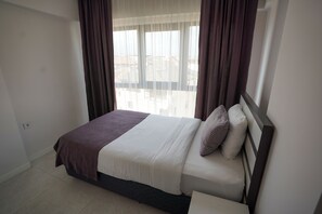 Comfort Suite, Multiple Beds | Free minibar, in-room safe, desk, laptop workspace