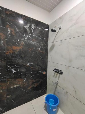 Deluxe Triple Room, City View | Bathroom | Shower, free toiletries, hair dryer, slippers - Hotel Tirupati Inn (Ujjain)