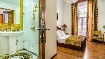 Shower, rainfall showerhead, designer toiletries, hair dryer