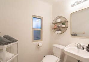 Shower, hair dryer, towels