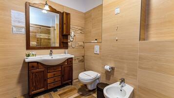 Suite, Balcony, Lake View | Bathroom | Slippers, towels, soap, shampoo