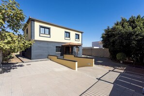 A modern two-story building with a flat roof, large windows, and a small covered entrance. - Home2Book Villa Jazmín Real Heated pool & views (Arafo)