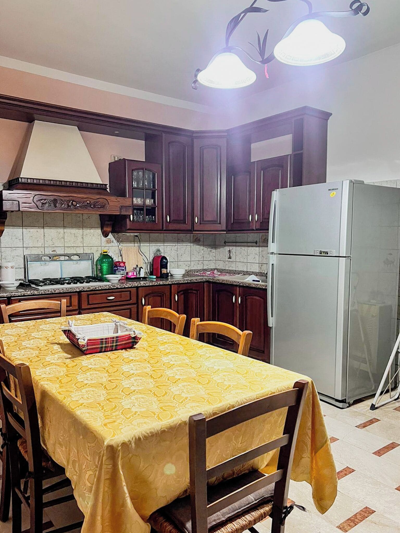 Full-sized fridge, oven, stovetop, cookware/dishes/utensils