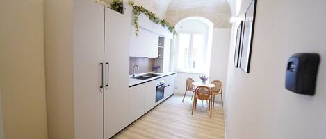 Mini-fridge, stovetop, cookware/dishes/utensils