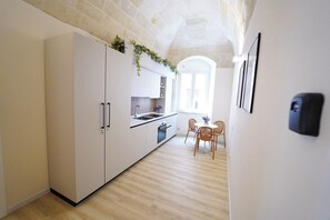 Mini-fridge, stovetop, cookware/dishes/utensils