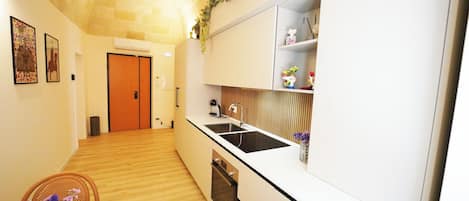 Mini-fridge, stovetop, cookware/dishes/utensils