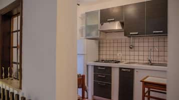 Mini-fridge, stovetop, cookware/dishes/utensils