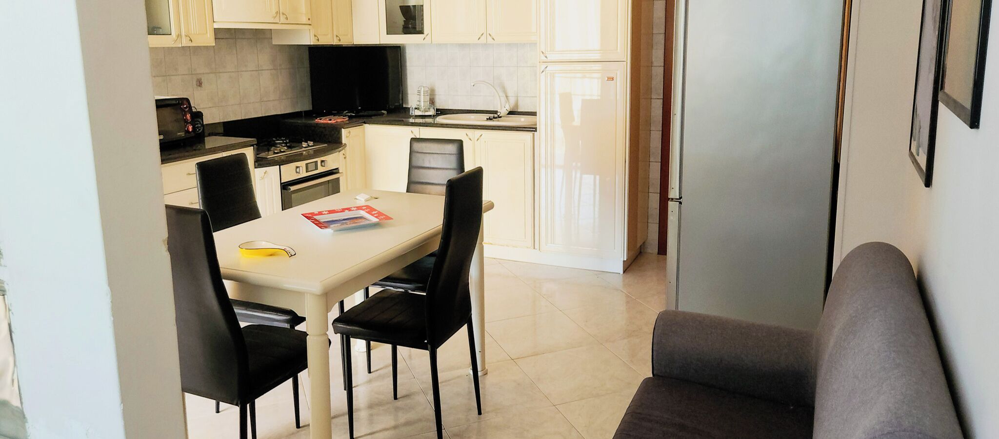 Full-sized fridge, microwave, stovetop, cookware/dishes/utensils