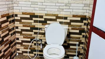 Shower, towels, soap, toilet paper