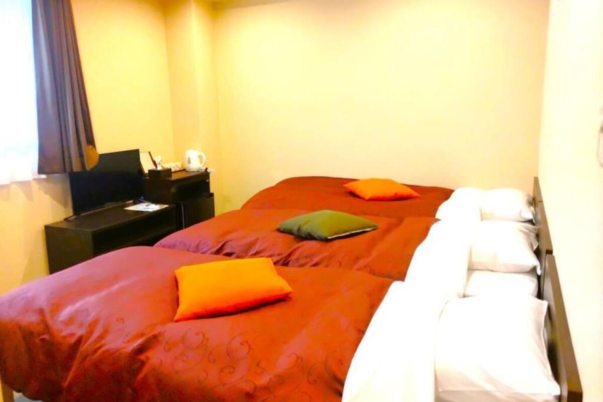 Triple Room, City View | Soundproofing, iron/ironing board, free WiFi