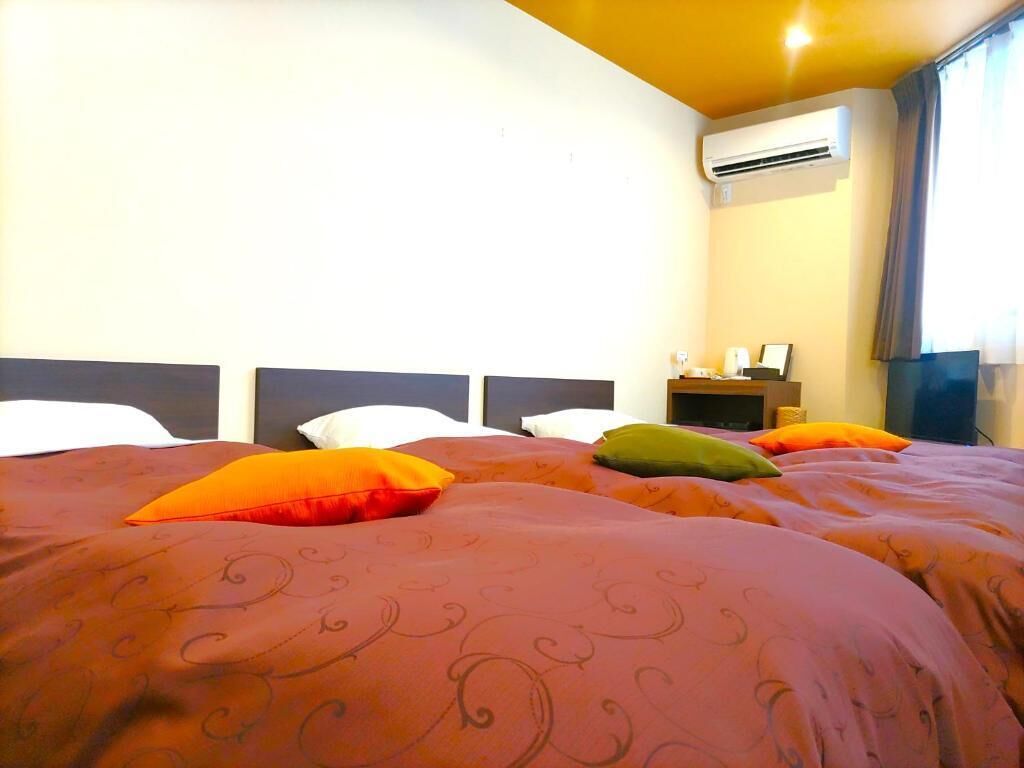 Triple Room, City View | Soundproofing, iron/ironing board, free WiFi