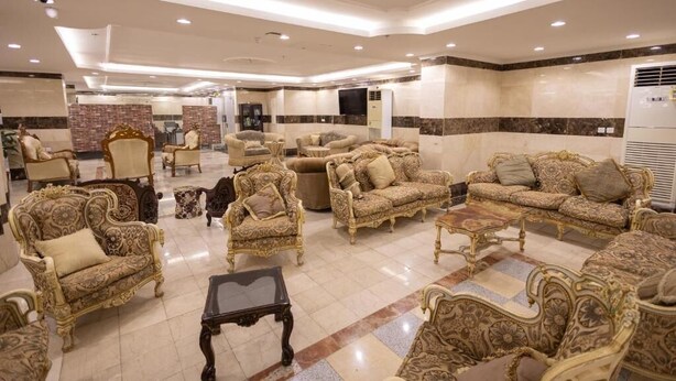 A spacious lobby with ornate, gold-accented furniture and a tiled floor. - Al Zaireen 2 (Makkah)