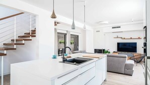 A modern kitchen with a central island, built-in appliances, and pendant lighting. - Villa High Life - Four Bedroom Villa, Sleeps 9 (Seget Vranjica)