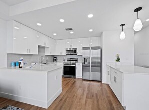 Fridge, microwave, oven, stovetop - Waterfront Coastal Elegance Top Floor at The Strand (Sarasota)