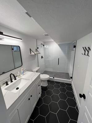 Shower, hair dryer, towels, soap