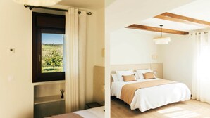 Ein Schlafzimmer mit einem Bett, einem Fenster mit Vorhängen, einem Nachttisch und einer Pendelleuchte.