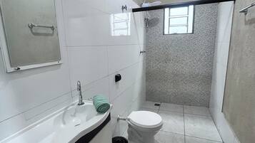 Shower, towels, soap, toilet paper