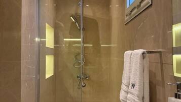 Shower, towels, soap, toilet paper