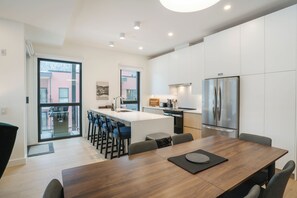 Luxury Condo, Mountain View | Private kitchen | Full-size fridge, microwave, oven, stovetop - The Luxury Basecamp (Revelstoke)