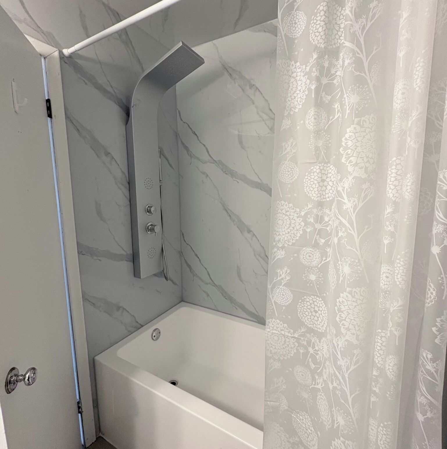 Combined shower/bathtub, hair dryer, towels, soap