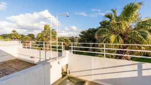 A rooftop terrace with a concrete floor, a small water feature, and a metal railing. - Apartment 'Casa Le Vele' with Private Terrace, Wi-Fi and Air Conditioning (Galatone)