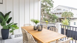 A wooden ceiling, a wooden table with chairs, and potted plants. - Family-Friendly Home w/ Pool & Arcade Near Beach (North Myrtle Beach)