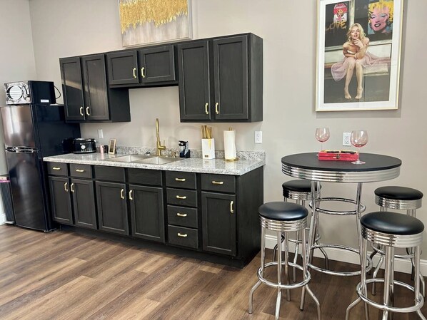 Microwave, coffee/tea maker, toaster, dining tables