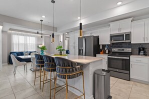 Fridge, microwave, oven, stovetop - Stylish 2-Bedroom Retreat • Storey Lake Resort (Kissimmee)
