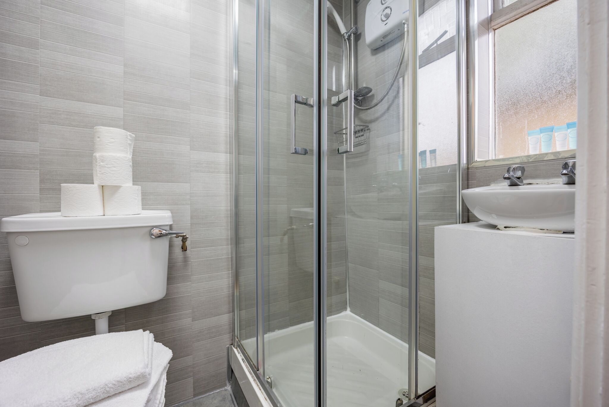 Shower, hair dryer, towels, soap