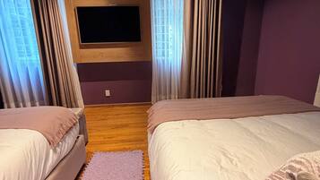 Habitación cuádruple Deluxe | Caja de seguridad en la habitación, cortinas blackout y wifi gratis