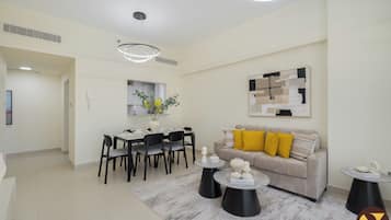 Luxury Apartment, Balcony, City View | Living room | 65-inch Smart TV with cable channels