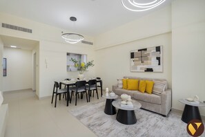 Luxury Apartment, Balcony, City View | Living room | 65-inch Smart TV with cable channels - Vogue | Jeewar By Badr JVC near Circle Mall (Dubai)