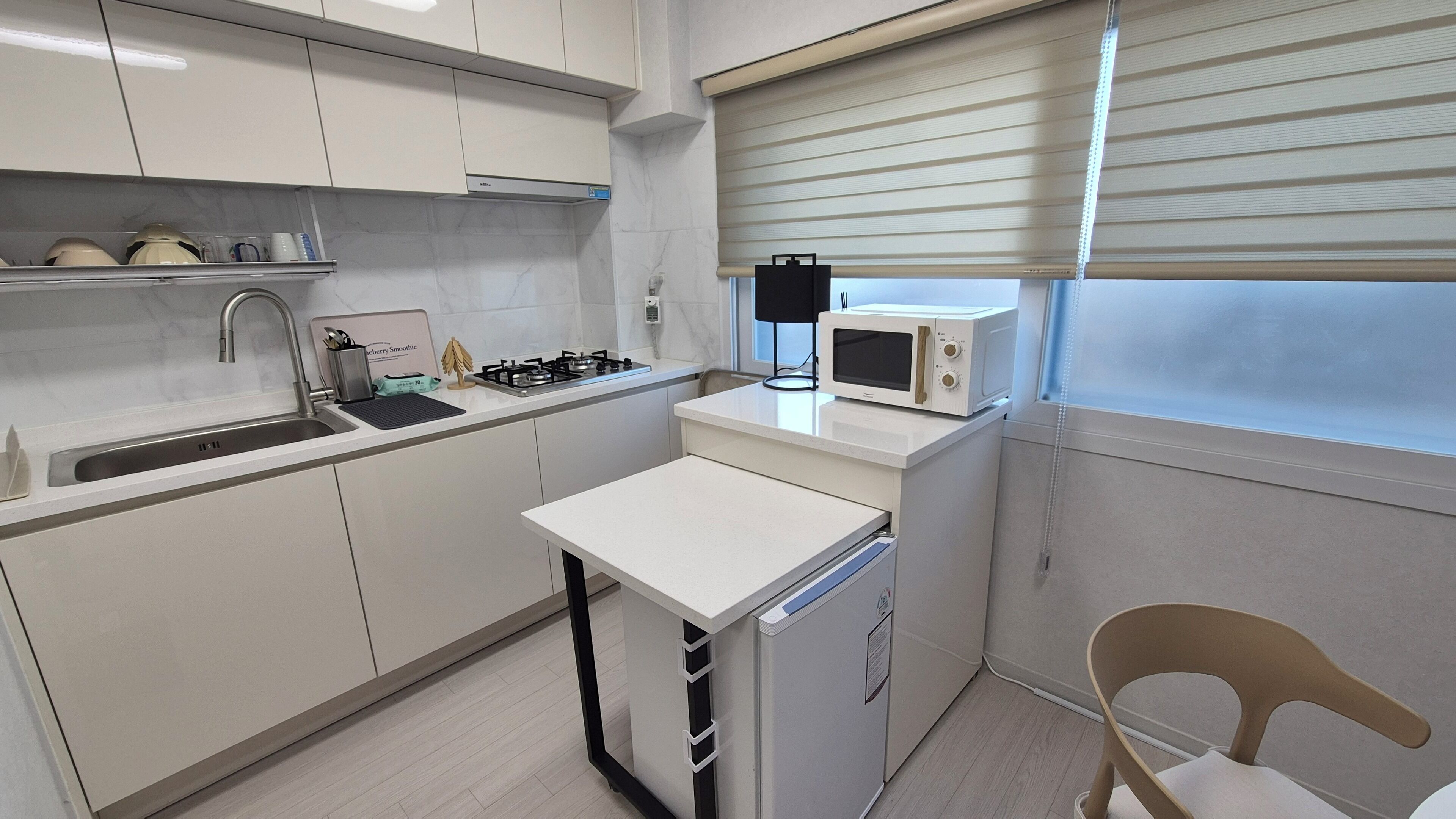 Full-size fridge, microwave, cookware/dishes/utensils