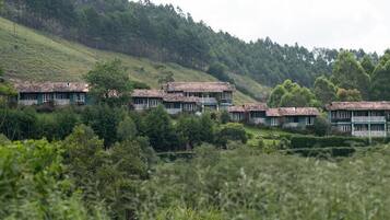 Suíte conforto, vista para o jardim | Fachada